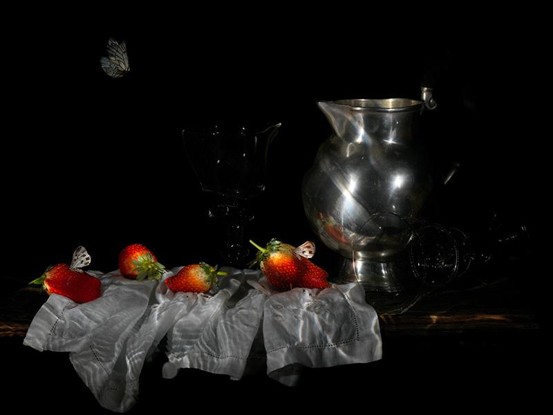 butterfly strawberries and water jug on table still life vanitas